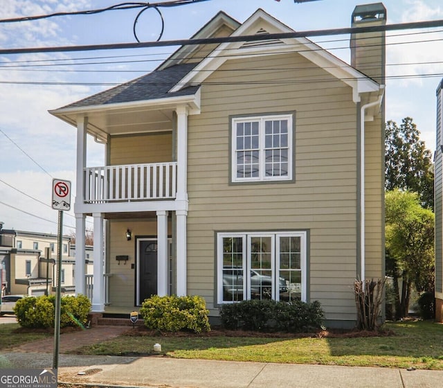 484 Martin St SE, Atlanta, GA 30312 - view of front facade featuring a chimney and a balcony
