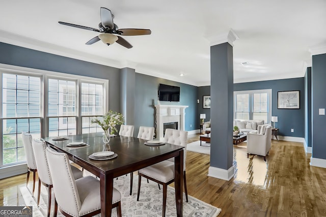 484 Martin St SE, Atlanta, GA 30312 - dining room with baseboards, a healthy amount of sunlight, wood finished floors, and ornamental molding