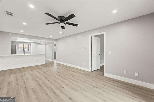 unfurnished living room with light wood finished floors, recessed lighting, visible vents, ceiling fan, and baseboards