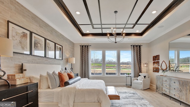 bedroom with a tray ceiling, baseboards, light wood finished floors, and recessed lighting