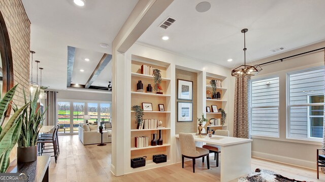 office space featuring recessed lighting, built in features, visible vents, and light wood-style floors