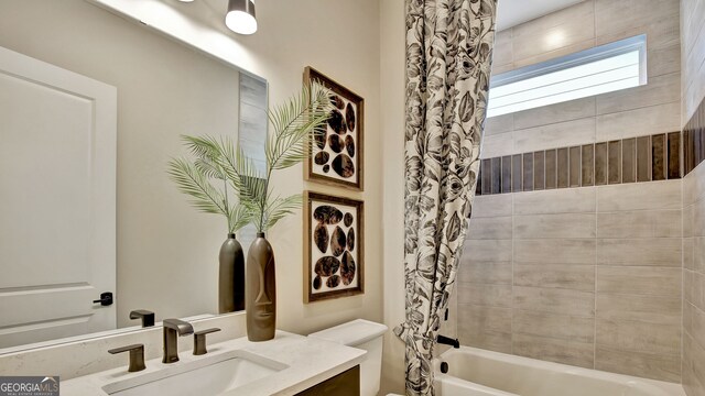 bathroom with toilet, vanity, and shower / bathtub combination with curtain