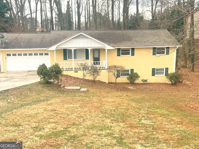 ranch-style home featuring concrete driveway, a porch, a front lawn, and an attached garage