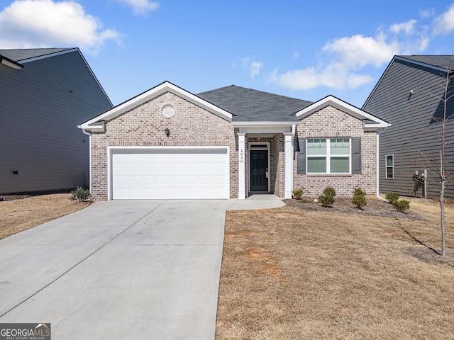 single story home with an attached garage, roof with shingles, concrete driveway, and brick siding