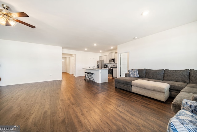2030 Vidalia Ct, Dacula, GA 30019 - living area featuring a ceiling fan, dark wood-style floors, recessed lighting, and baseboards