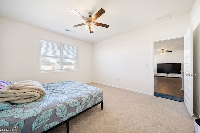 2030 Vidalia Ct, Dacula, GA 30019 - bedroom with carpet floors, baseboards, and ceiling fan