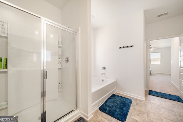 2030 Vidalia Ct, Dacula, GA 30019 - bathroom with a bath, a stall shower, ceiling fan, and baseboards