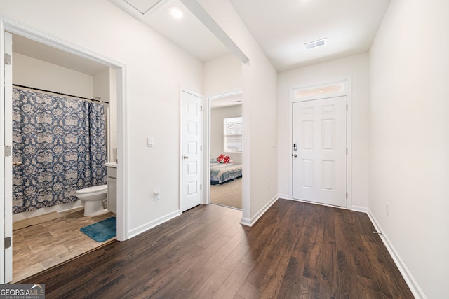 2030 Vidalia Ct, Dacula, GA 30019 - foyer entrance with dark wood-style floors and baseboards