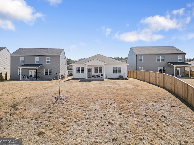 2030 Vidalia Ct, Dacula, GA 30019 - back of house featuring a patio, a fenced backyard, and a residential view