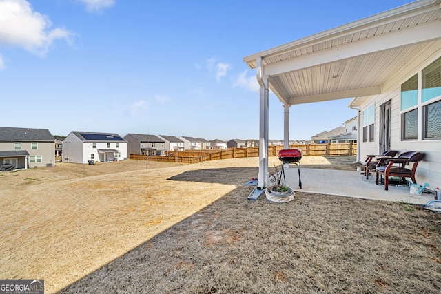 2030 Vidalia Ct, Dacula, GA 30019 - fenced backyard featuring a patio area and a residential view