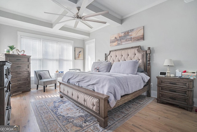 bedroom featuring beamed ceiling, light wood-style floors, ornamental molding, and coffered ceiling