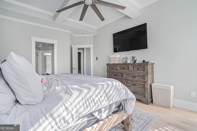 bedroom with crown molding, baseboards, ceiling fan, beamed ceiling, and wood finished floors