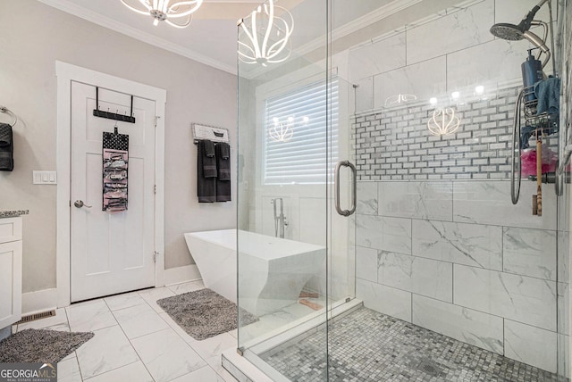 bathroom featuring a stall shower, a soaking tub, marble finish floor, and ornamental molding