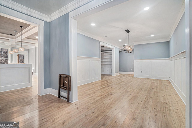 unfurnished dining area with crown molding, recessed lighting, and light wood-style floors