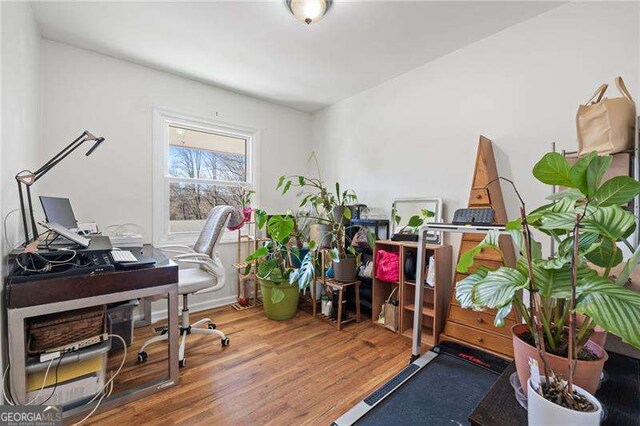 office space with wood finished floors