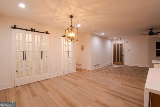 unfurnished dining area with visible vents, baseboards, light wood-style flooring, and recessed lighting