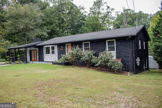 single story home with french doors, brick siding, a chimney, and a front lawn