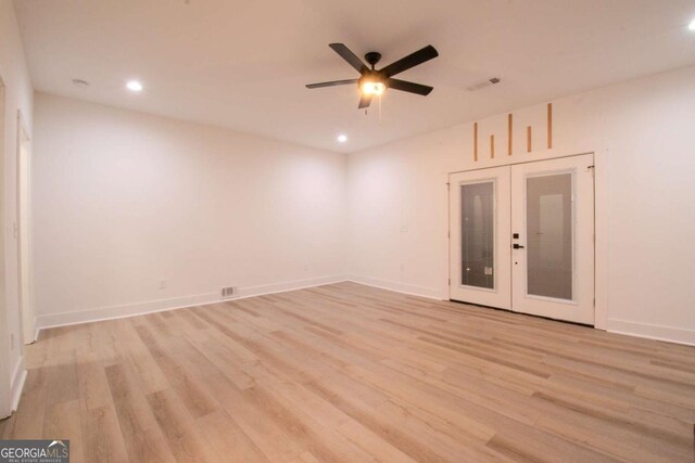 unfurnished room with recessed lighting, light wood-type flooring, a ceiling fan, and baseboards