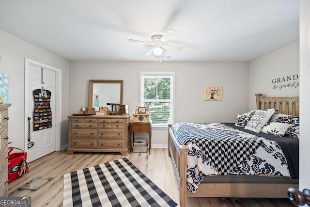 bedroom with a ceiling fan and wood finished floors