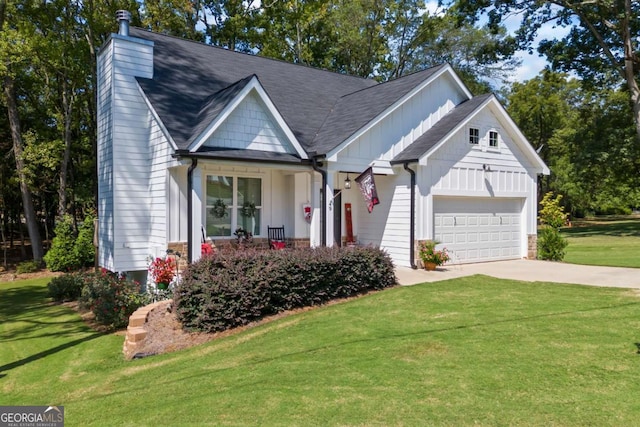 view of front of property featuring a chimney, an attached garage, board and batten siding, a front yard, and driveway