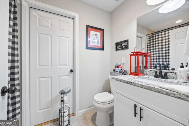 full bath with tile patterned flooring, vanity, and toilet