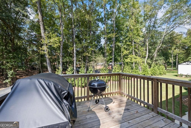 wooden deck featuring area for grilling