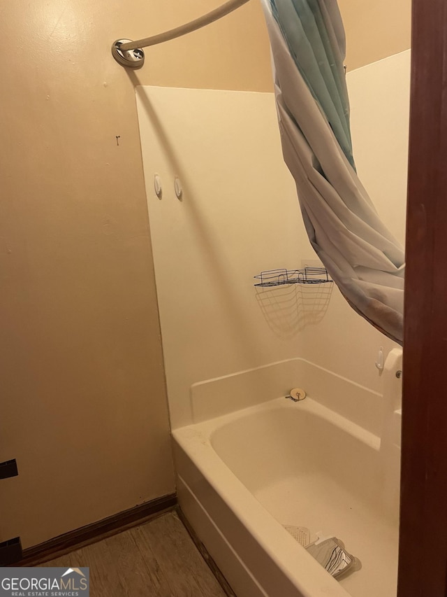 405415 Chase Dr, Fayetteville, GA 30214 - bathroom featuring a bath and wood finished floors