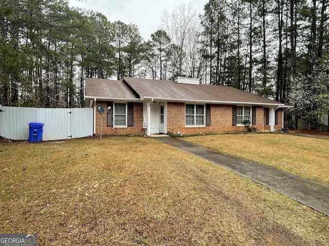 405415 Chase Dr, Fayetteville, GA 30214 - ranch-style house with brick siding, a gate, a chimney, and view of scattered trees