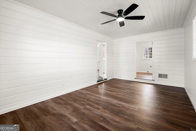 empty room featuring visible vents, ornamental molding, a ceiling fan, wood finished floors, and wooden ceiling