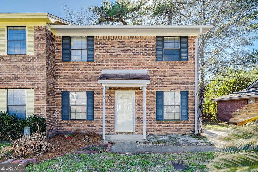 view of front of home with brick siding