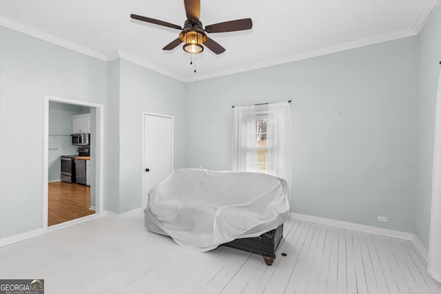 bedroom with a ceiling fan, baseboards, ornamental molding, and wood finished floors