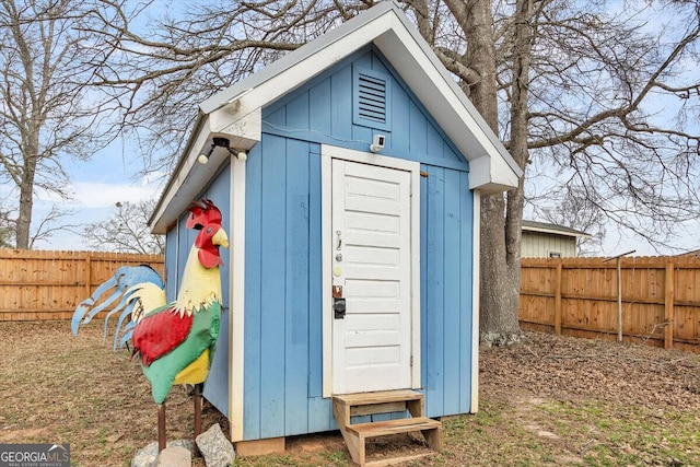 view of shed featuring a fenced backyard