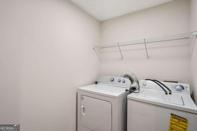 clothes washing area with laundry area and independent washer and dryer