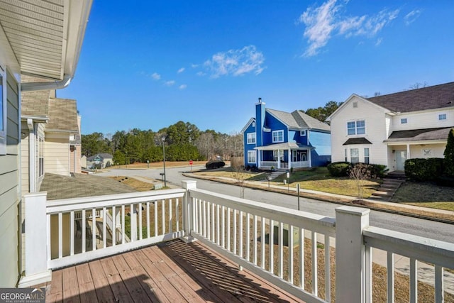 wooden deck with a residential view