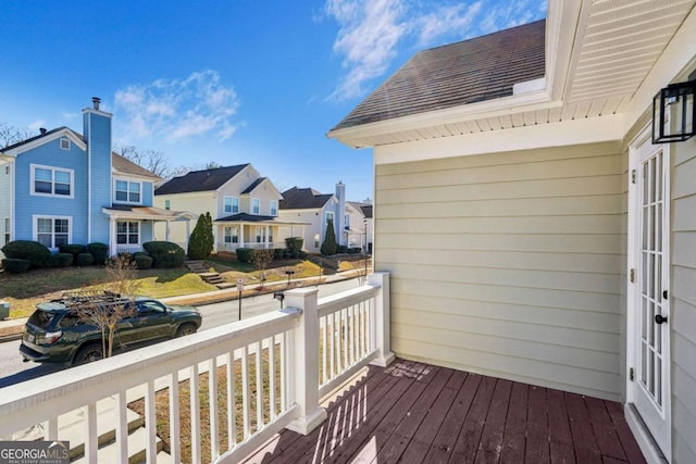 wooden terrace with a residential view