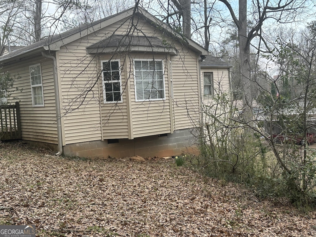 view of side of home with crawl space