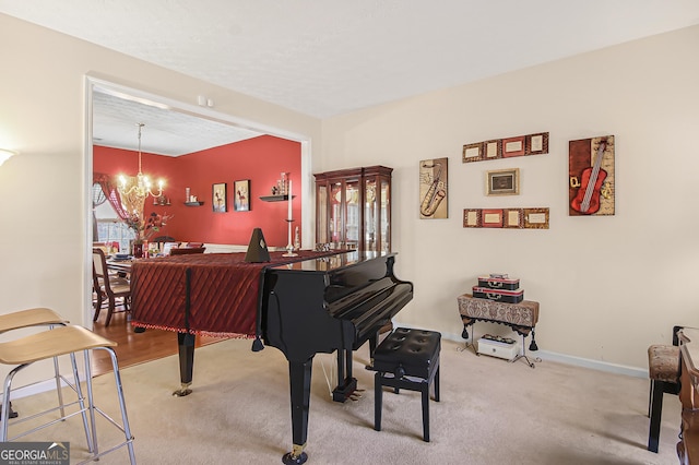 living area with carpet floors, an inviting chandelier, and baseboards