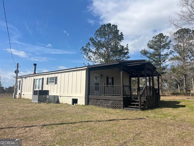 exterior space featuring a porch, crawl space, and a lawn