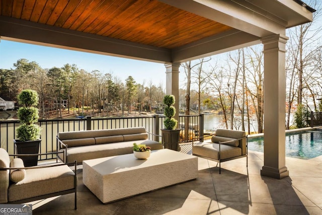 view of patio / terrace featuring outdoor lounge area and an outdoor pool