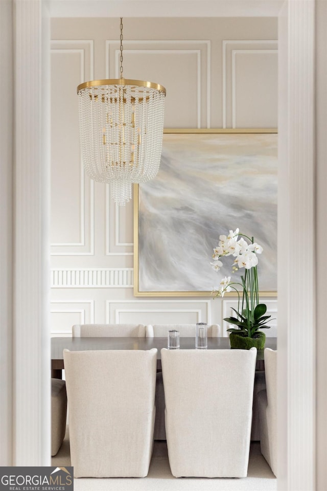 dining area with an inviting chandelier