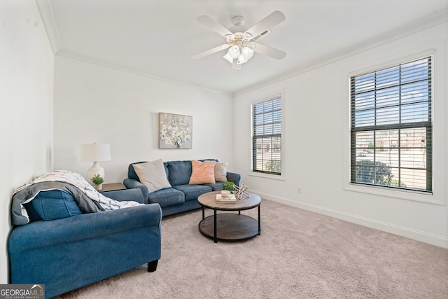 living room with carpet flooring, a healthy amount of sunlight, baseboards, and ornamental molding