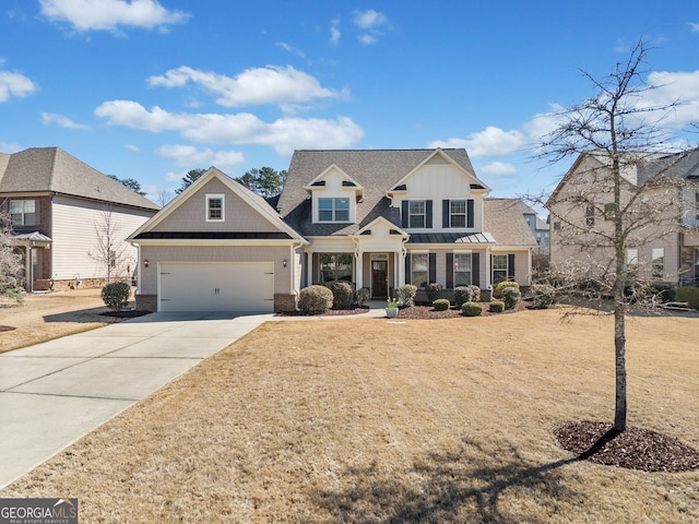 view of front of home with a standing seam roof, a garage, brick siding, and driveway