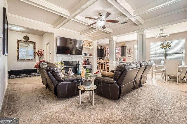 carpeted living room with coffered ceiling, a fireplace, beamed ceiling, and ornate columns