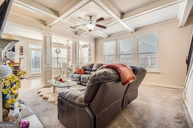 living area featuring a ceiling fan, decorative columns, visible vents, and beam ceiling