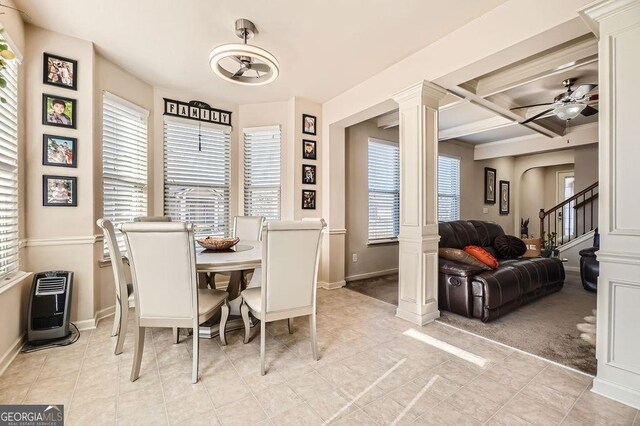 dining space with baseboards, coffered ceiling, a ceiling fan, heating unit, and ornate columns