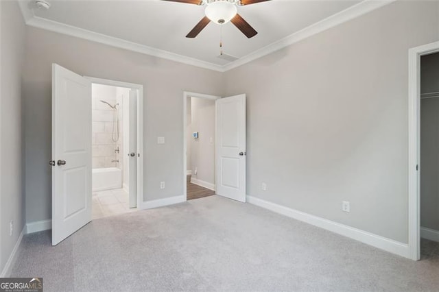 unfurnished bedroom with baseboards, carpet, and crown molding