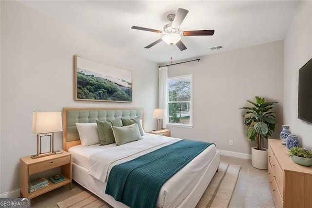 bedroom featuring visible vents, ceiling fan, light carpet, and baseboards