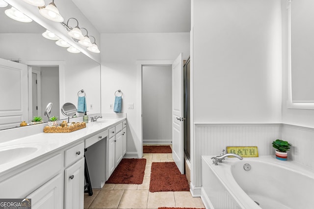 full bathroom with tile patterned floors, a sink, a shower stall, double vanity, and a bath