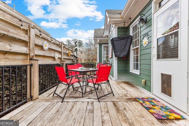 wooden deck with outdoor dining space