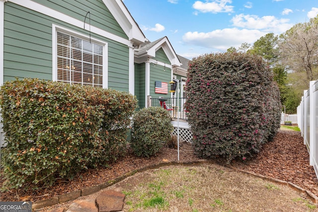 view of yard featuring fence and a wooden deck